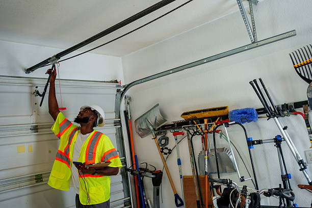 Professional Garage Door Panel Replacement technician working in Roland, IA